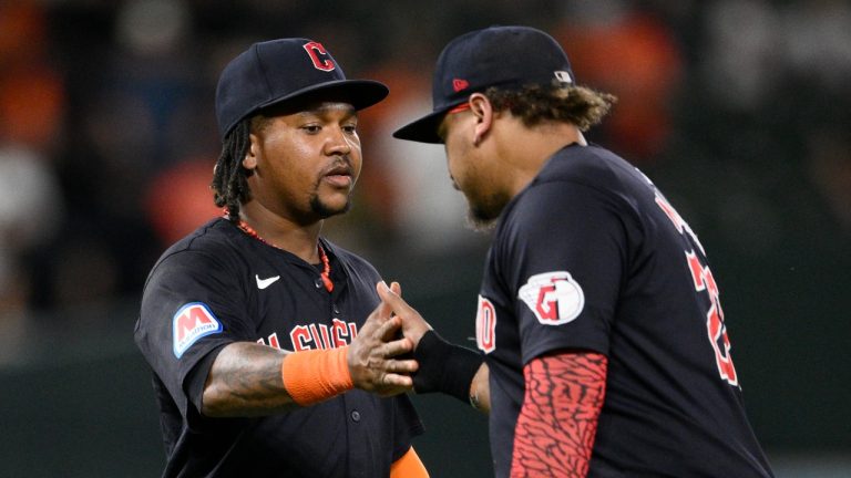 Cleveland Guardians' Jose Ramirez, left, and Josh Naylor, right, celebrate after a win over the Baltimore Orioles, June 24, 2024. (AP Photo/Nick Wass)