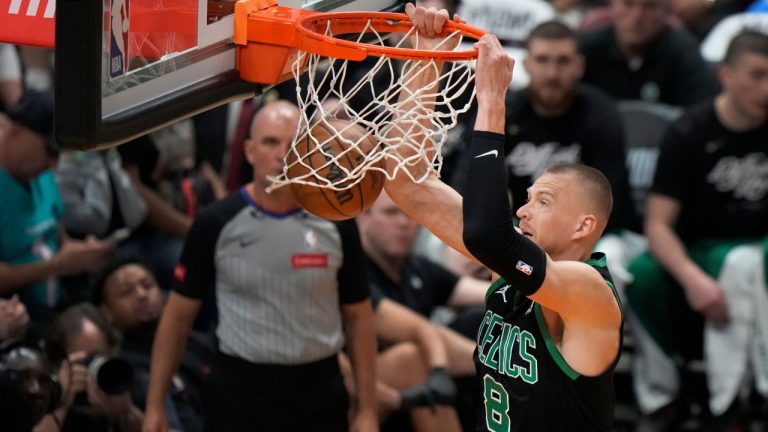 Boston Celtics forward Kristaps Porzingis dunks the ball during the first half of Game 3 of an NBA basketball first-round playoff series against the Miami Heat, Saturday, April 27, 2024, in Miami. (Wilfredo Lee/AP Photo)