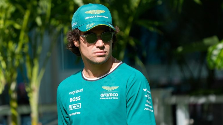 Aston Martin driver Lance Stroll of Canada arrives before the start of the Sprint race at the Formula One Miami Grand Prix auto race at the Miami International Autodrome, Saturday, May 4, 2024, in Miami Gardens, Fla. (AP Photo/Wilfredo Lee)