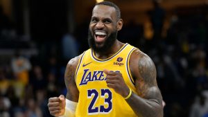 Los Angeles Lakers forward LeBron James smiles toward the Memphis Grizzlies bench in the second half of an NBA basketball game Friday, April 12, 2024, in Memphis, Tenn. (Brandon Dill/AP Photo)