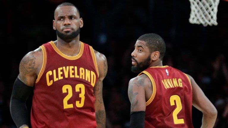 Cleveland Cavaliers' LeBron James, left, greets Kyrie Irving during the second half of an NBA basketball game against the Los Angeles Lakers in Los Angeles. (AP Photo/Jae C. Hong)