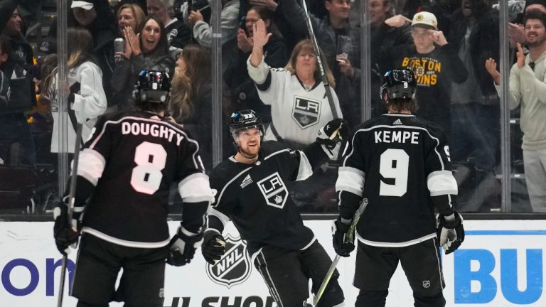 Los Angeles Kings' Viktor Arvidsson celebrates with Drew Doughty and Adrian Kempe after a goal in the third period against the Chicago Blackhawks, April 18, 2024. (AP Photo/Ashley Landis)