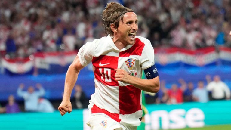 Croatia's Luka Modric celebrates after scoring his side's opening goal during a Group B match between Croatia and Italy at the Euro 2024 soccer tournament in Leipzig, Germany, Monday, June 24, 2024. (AP Photo/Ebrahim Noroozi)