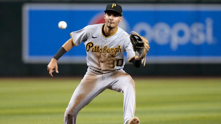 Former Pittsburgh Pirates shortstop Tucupita Marcano takes a throw down to second base during the fifth inning of a baseball game. Marcano, most recently a member of the San Diego Padres, was banned for life by baseball on Tuesday for betting on the game. (Ross D. Franklin/AP)