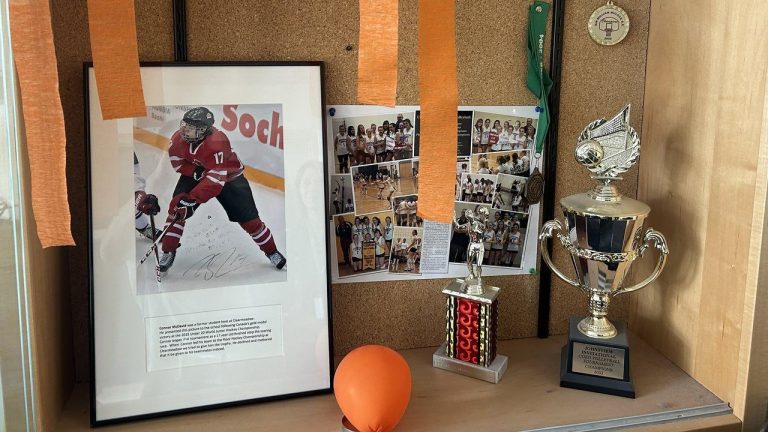 A framed Connor McDavid photo, complete with decorations in Edmonton Oilers colours, is on display in a trophy case at Clearmeadow Public School in Newmarket, Ontario as seen on Wednesday June 12, 2024. McDavid, who grew up in the town of 90,000 just north of Toronto, used to attend the elementary school. 
(Gregory Strong/CP)