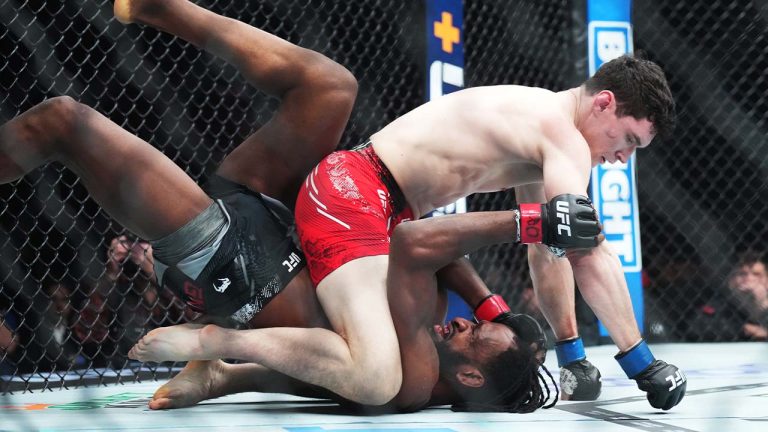 Mike Malott, top, fights Neil Magny during a welterweight bout at UFC 297 in Toronto on Saturday, January 20, 2024. (Nathan Denette/CP)