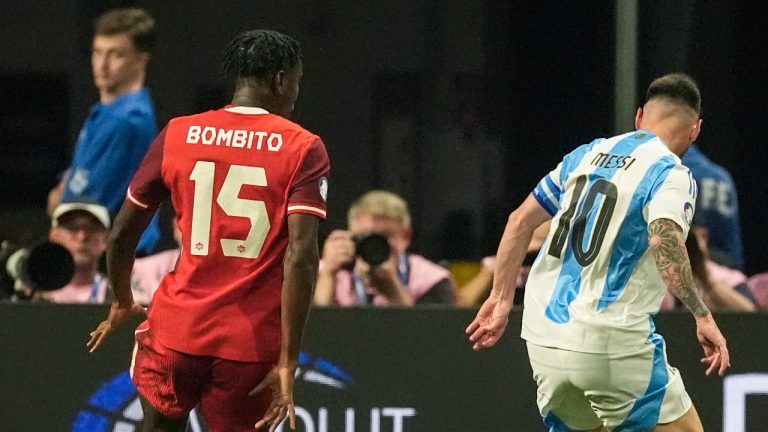 Argentina's Lionel Messi, moves near Canada's Canada's Moise Bombito in the first half during a Copa America, Thursday, June 20, 2024. (AP Photo/Mike Stewart)