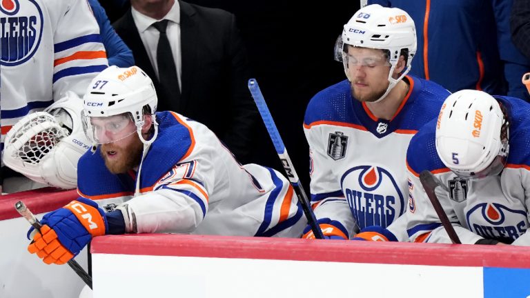 Edmonton Oilers forward Connor McDavid (97), defenceman Philip Broberg (86) and defenceman Cody Ceci (5) react after losing to the Florida Panthers in game 7 of the NHL Stanley Cup finals in Sunrise, Fla., on Monday, June 24, 2024. (CP)