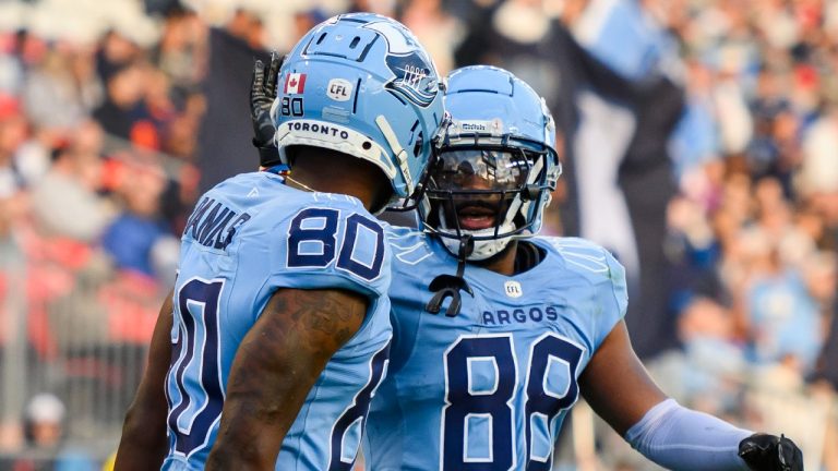 Toronto Argonauts' Rasheed Bailey (88) and DaVaris Daniels (80) celebrate a touchdown during a game against the B.C. Lions, June 9, 2024. (The Canadian Press/Christopher Katsarov)