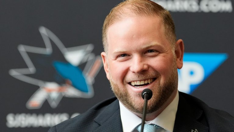 Ryan Warsofsky speaks at a news conference where he was introduced as the NHL hockey head coach of the San Jose Sharks in San Jose, Calif., Monday, June 17, 2024. (AP Photo/Jeff Chiu)