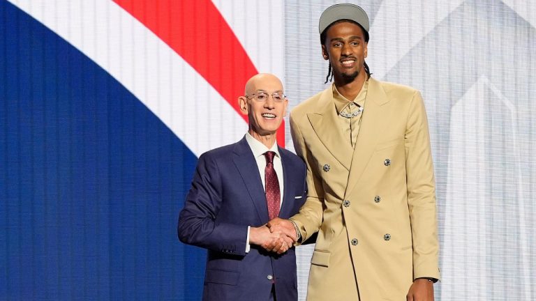 Alex Sarr poses for a photo with NBA commissioner Adam Silver after being selected as the second pick in the NBA basketball draft during the first round by the Washington Wizards, Wednesday, June 26, 2024, in New York. (Julia Nikhinson/AP Photo)