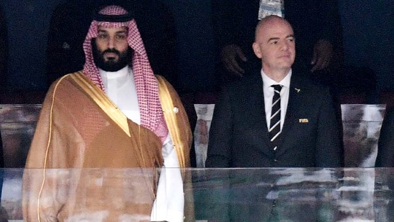 Saudi Arabia Crown Prince Mohammed bin Salman, left, and FIFA President Gianni Infantino, stand for the anthem prior to the match between Russia and Saudi Arabia which opened the 2018 soccer World Cup at the Luzhniki stadium in Moscow, Russia, on June 14, 2018. (Alexei Nikolsky/AP)