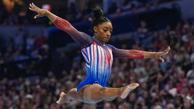 Simone Biles competes on the balance beam at the United States Gymnastics Olympic Trials on Sunday, June 30, 2024, in Minneapolis. (Abbie Parr/AP)