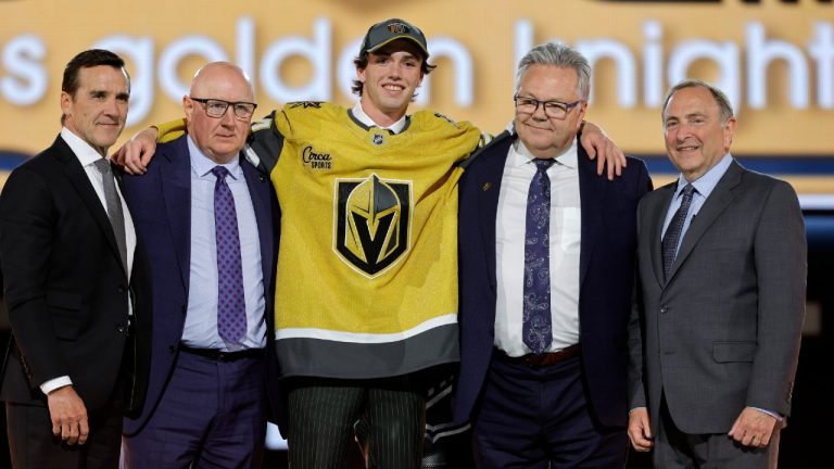 Trevor Connelly, center, poses after being selected by the Vegas Golden Knights during the first round of the NHL hockey draft Friday, June 28, 2024, in Las Vegas. (Steve Marcus/AP)