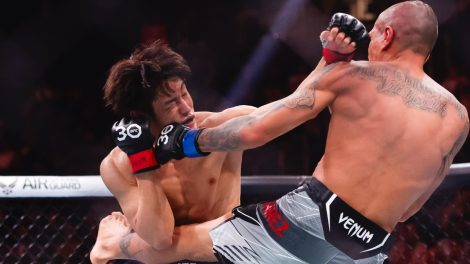 Tatsuro-Taira,-left,-punches-Edgar-Chairez-during-a-catchweight-mixed-martial-arts-bout-at-UFC-290-in-Las-Vegas