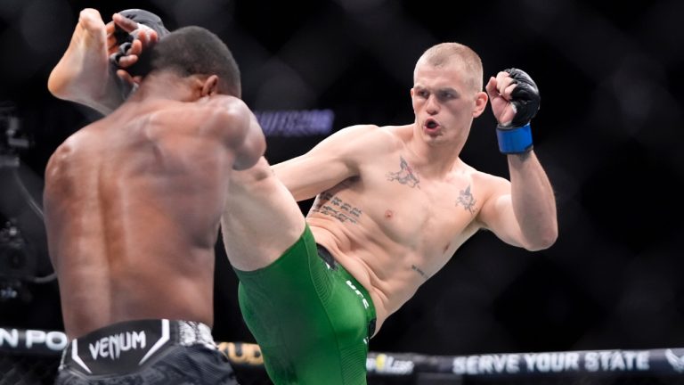 Ian Machado Garry, right, throws a kick to Geoff Neal during their welterweight bout at the UFC 298 in Anaheim, Calif. (Mark J. Terrill/AP)