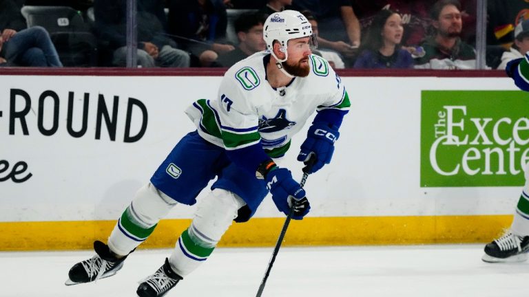 Vancouver Canucks defenseman Filip Hronek skates with the puck against the Arizona Coyotes during the first period of an NHL hockey game Wednesday, April 3, 2024, in Tempe, Ariz. (Ross D. Franklin/AP)