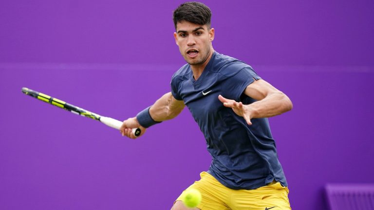 Spain's Carlos Alcaraz plays Argentina's Francisco Cerundolo during their men's singles match on day four of The Queen's Club tennis tournament, in London, Tuesday, June 18, 2024. (Zac Goodwin/PA via AP)