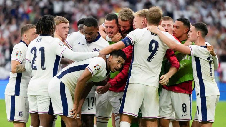 England's Jude Bellingham, bottom center, celebrates his goal with teammates during a round of sixteen match between England and Slovakia at the Euro 2024 soccer tournament. (Matthias Schrader/AP)