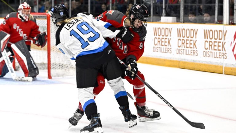 Toronto's Rebecca Leslie (19) tries to prevent Ottawa's Zoe Boyd (3) from gathering a rebound during first period PWHL hockey action in Ottawa, on Saturday, March 2, 2024. (Justin Tang/CP)