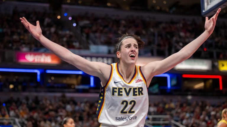 Indiana Fever guard Caitlin Clark reacts after scoring against the Seattle Storm during the first half of a WNBA basketball game Thursday, May 30, 2024, in Indianapolis. (Doug McSchooler/AP Photo)