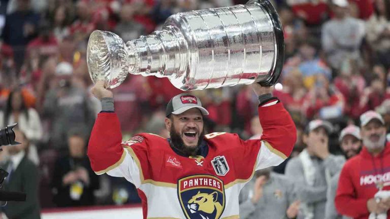 Florida Panthers right wing Kyle Okposo raises the NHL hockey Stanley Cup trophy after defeating the Edmonton Oilers, Monday, June 24, 2024, in Sunrise, Fla. (Wilfredo Lee/AP)