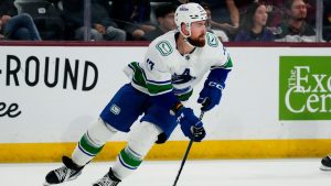 Vancouver Canucks' Filip Hronek skates with the puck against the Arizona Coyotes during the first period of an NHL hockey game Wednesday, April 3, 2024, in Tempe, Ariz. The Vancouver Canucks have signed defenceman Filip Hronek to an eight-year extension with an average annual value of US$7.25 million. (Ross D. Franklin/AP)