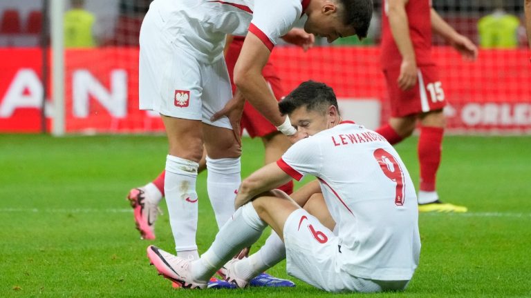 Poland's Robert Lewandowski, bottom, reacts during the international friendly soccer match between Poland and Turkey at the National stadium in Warsaw, Poland, Monday, June 10, 2024. (Czarek Sokolowski/AP)