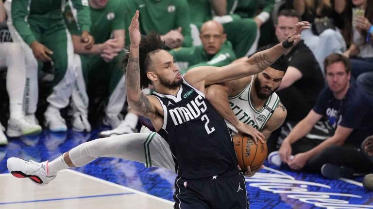 Dallas Mavericks center Dereck Lively II (2) and Boston Celtics forward Jayson Tatum (0) vie for a rebound during the second half in Game 4 of the NBA basketball finals. (Julio Cortez/AP)