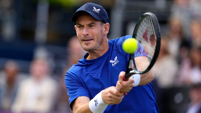 Andy Murray of Britain plays a return to Jordan Thompson of Australia during their men's singles match on day five of The Queen's Club tennis tournament, in London, Wednesday, June 19, 2024. (Kirsty Wigglesworth/AP)