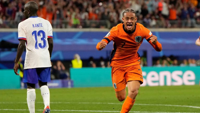 Xavi Simons of the Netherlands, right, celebrates after scoring a goal that was then disallowed for offside during the Group D match between the Netherlands and France at the Euro 2024 soccer tournament in Leipzig, Germany, Friday, June 21, 2024. (Hassan Ammar/AP)