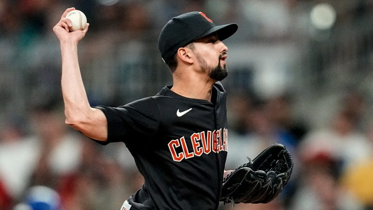 Cleveland Guardians pitcher Nick Sandlin (52) delivers in the 11th inning of a baseball game against the Atlanta Braves, Saturday, April 27, 2024, in Atlanta. (Mike Stewart/AP)