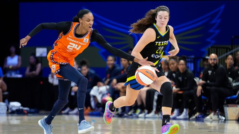 Connecticut Sun forward DeWanna Bonner (24) reaches a loose ball ahead of Dallas Wings forward Maddy Siegrist (20) during the second half of a WNBA basketball basketball game in Arlington, Texas, Saturday, June 15, 2024. (LM Otero/AP)