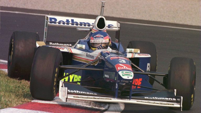 Jacques Villeneuve of Williams Renault goes up on the grass as he rounds the hairpin during the qualifying round at the 1997 Canadian Grand Prix in Montreal. (Jacques Boissinot/CP PHOTO)