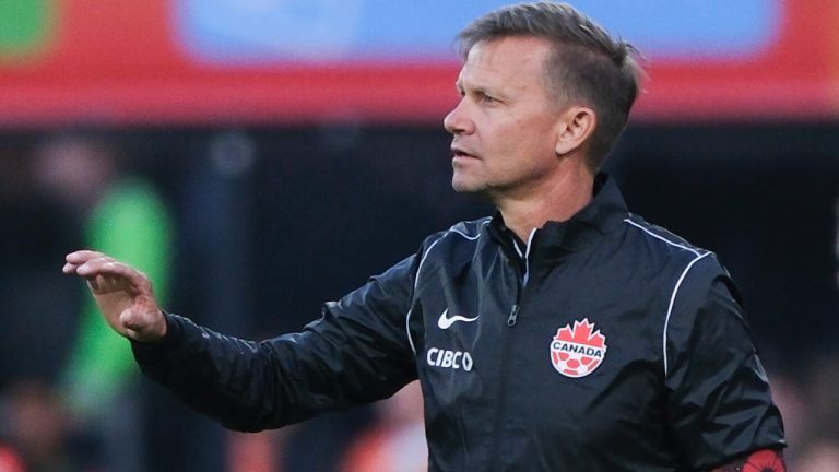 Canada coach Jesse Marsch, wearing a special armband for D-Day, gestures to his players during the international friendly soccer match between the Netherlands and Canada at De Kuip stadium in Rotterdam, Netherlands, Thursday, June 6, 2024. (Patrick Post/AP)