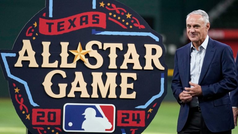 Major League Baseball Commissioner Rob Manfred smiles after helping to unveil the 2024 All-Star Game logo. (Tony Gutierrez/AP)