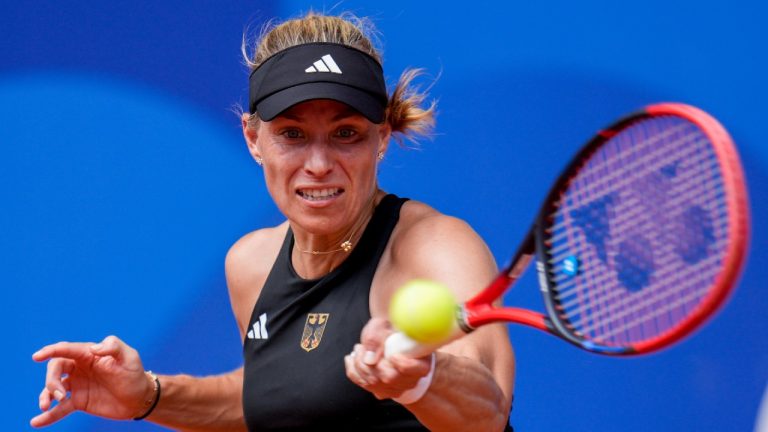 Angelique Kerber of Germany returns the ball against Qinwen Zheng of China during their women's single quarter-final tennis competition at the Roland Garros stadium, at the 2024 Summer Olympics, Wednesday, July 31, 2024, in Paris, France. (Manu Fernandez/AP)