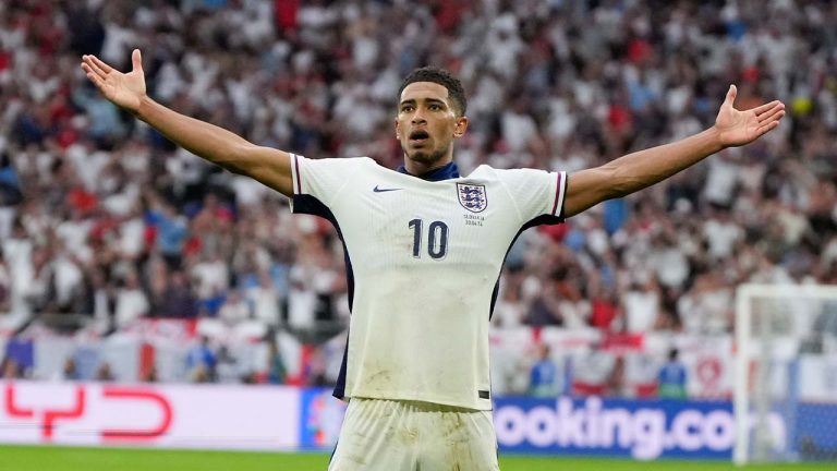 England's Jude Bellingham (10) celebrates with Harry Kane after scoring during a round of sixteen match between England and Slovakia at the Euro 2024 soccer tournament in Gelsenkirchen, Germany, Sunday, June 30, 2024. (Matthias Schrader/AP)