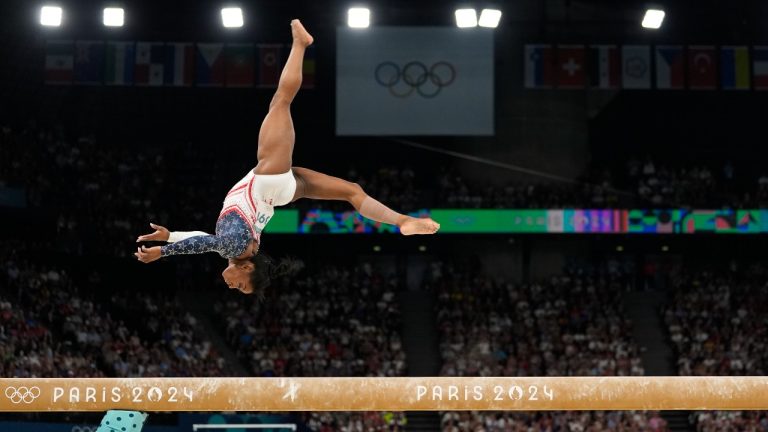 Simone Biles, of the United States, performs on the balance beam during the women's artistic gymnastics team finals round at Bercy Arena at the 2024 Summer Olympics, Tuesday, July 30, 2024, in Paris, France. (Abbie Parr/AP)