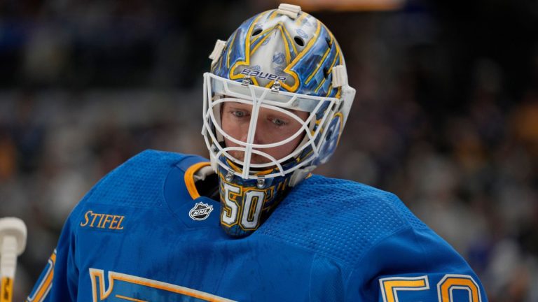 St. Louis Blues goaltender Jordan Binnington pauses during the first period of an NHL hockey game against the Pittsburgh Penguins Saturday, Oct. 21, 2023, in St. Louis. (Jeff Roberson/AP Photo)