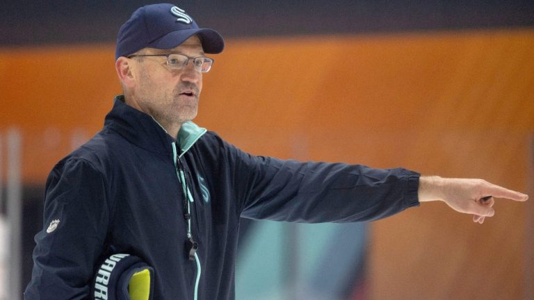 Seattle Kraken head coach Dan Bylsma directs players through a drill during a rookie development NHL training camp on Tuesday, July 2, 2024, in Seattle. Bylsma’s first on-ice duties as the Kraken head coach started Tuesday when the team began development camp for the top prospects in their system and concluded a wild five-week stretch for Bylsma. (The Seattle Times via AP)