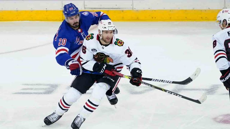 Chicago Blackhawks left wing Josiah Slavin (36) skates against New York Rangers left wing Chris Kreider (20) during the third period of an NHL hockey game, Saturday, Dec. 4, 2021, at Madison Square Garden in New York. The Rangers won 3-2. (Mary Altaffer/AP)