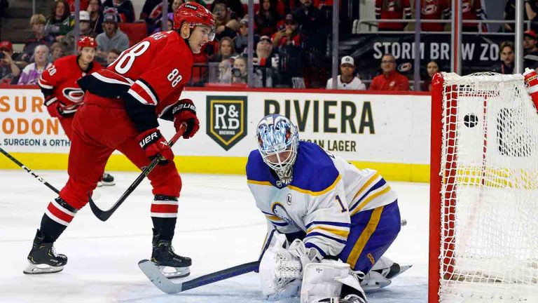 Carolina Hurricanes' Martin Necas (88) puts the puck in the top of the net past Buffalo Sabres goaltender Ukko-Pekka Luukkonen (1) for a game-winning goal during overtime of an NHL hockey game in Raleigh, N.C., Tuesday, Nov. 7, 2023. (Karl B DeBlaker/AP)