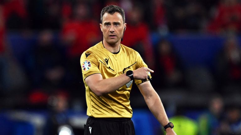 Referee Felix Zwayer from Germany points during a Group B match between Italy and Albania at the Euro 2024 soccer tournament in Dortmund, Germany, Saturday, June 15, 2024. (Bernd Thissen/dpa via AP) 