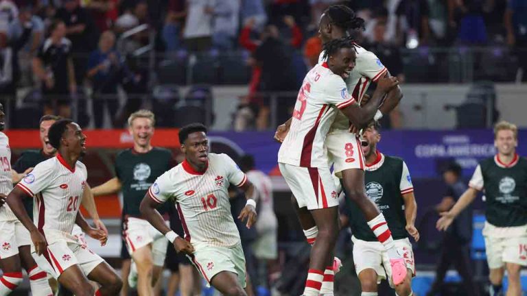 Canada midfielder Ismael Kone (8) celebrates with teammates after making the winning penalty kick against Venezuela a Copa America quarterfinal soccer match in Arlington, Texas, Friday, July 5, 2024. (Richard Rodriguez/AP)