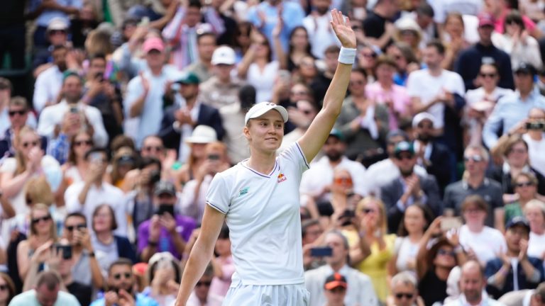 Elena Rybakina of Kazakhstan waves after defeating Elina Svitolina of Ukraine in their quarterfinal match at the Wimbledon tennis championships in London, Wednesday, July 10, 2024. (Kirsty Wigglesworth/AP)