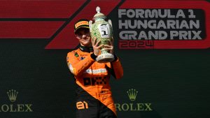 McLaren driver Oscar Piastri of Australia celebrates on the podium after winning the Hungarian Formula One Grand Prix race at the Hungaroring racetrack in Mogyorod, Hungary, Sunday, July 21, 2024. (Denes Erdos/AP) 