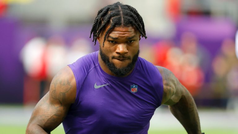 Minnesota Vikings running back Cam Akers warms up before an NFL game against the Kansas City Chiefs, Oct. 8, 2023. (AP Photo/Bruce Kluckhohn)