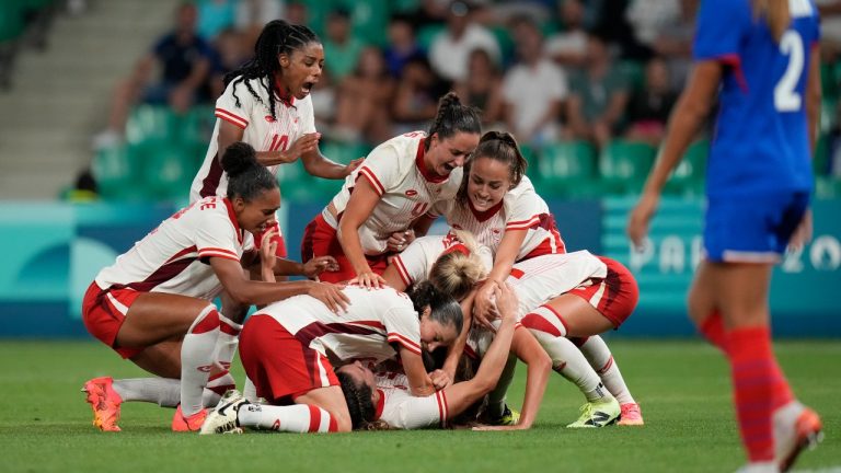 Canada's women's soccer team celebrates a goal. (Silvia Izquierdo/CP/AP)