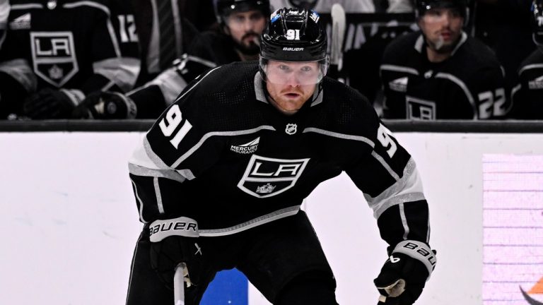 Los Angeles Kings right wing Carl Grundstrom controls the puck against the Buffalo Sabres during the second period of an NHL game in Los Angeles, Jan. 24, 2024. (AP Photo/Alex Gallardo)